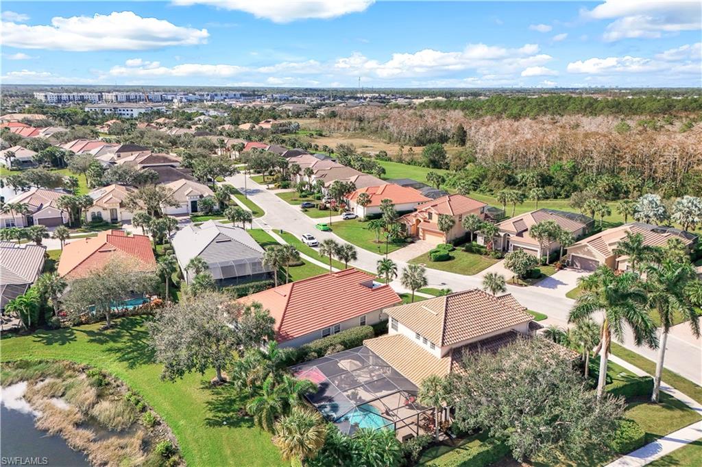 9104 Quartz Lane Naples, FL 34120 - Photo 34 of 47 an aerial view of residential houses with outdoor space and ocean view