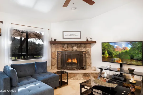a kitchen with stainless steel appliances granite countertop a sink a stove and cabinets