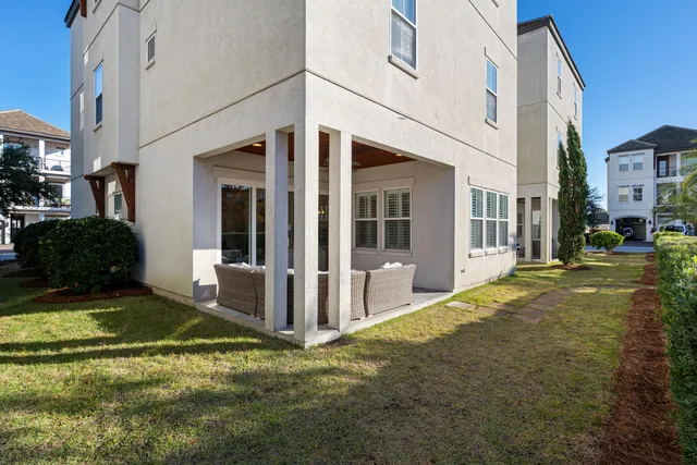 a bedroom with a bed window and a flat screen tv