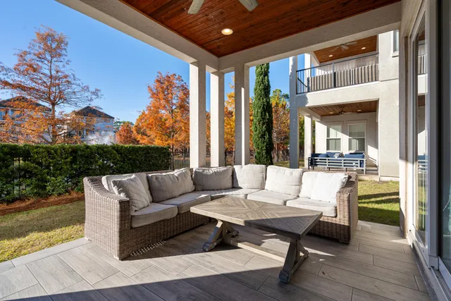 a bedroom with a bed and a flat tv screen on dresser