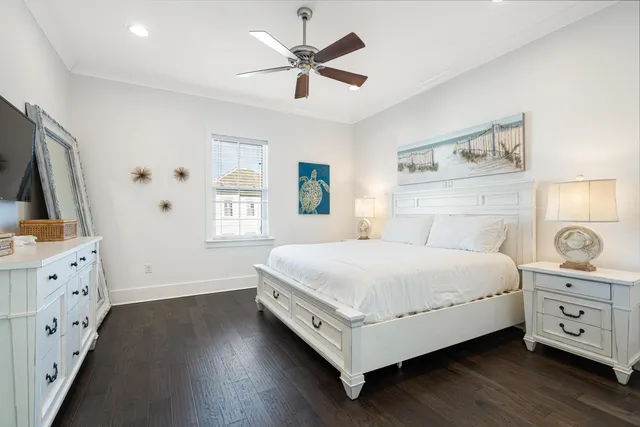 a bathroom with a granite countertop sink a toilet and a mirror