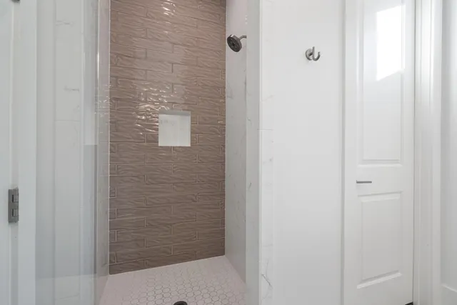 a bathroom with a granite countertop sink a toilet and a mirror