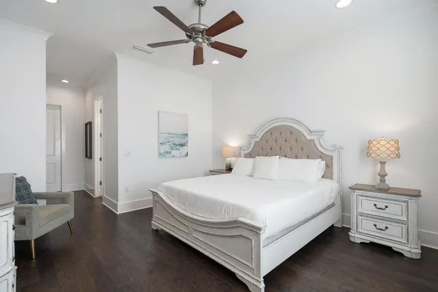 a bathroom with a granite countertop sink toilet and a mirror
