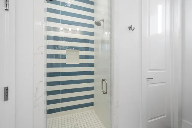 a large kitchen with kitchen island a large counter space a sink appliances and cabinets