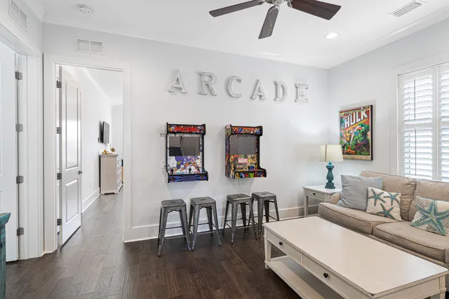 a view of a dining room with furniture a chandelier and wooden floor
