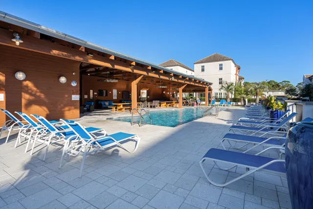 a view of a house with cars in front of it
