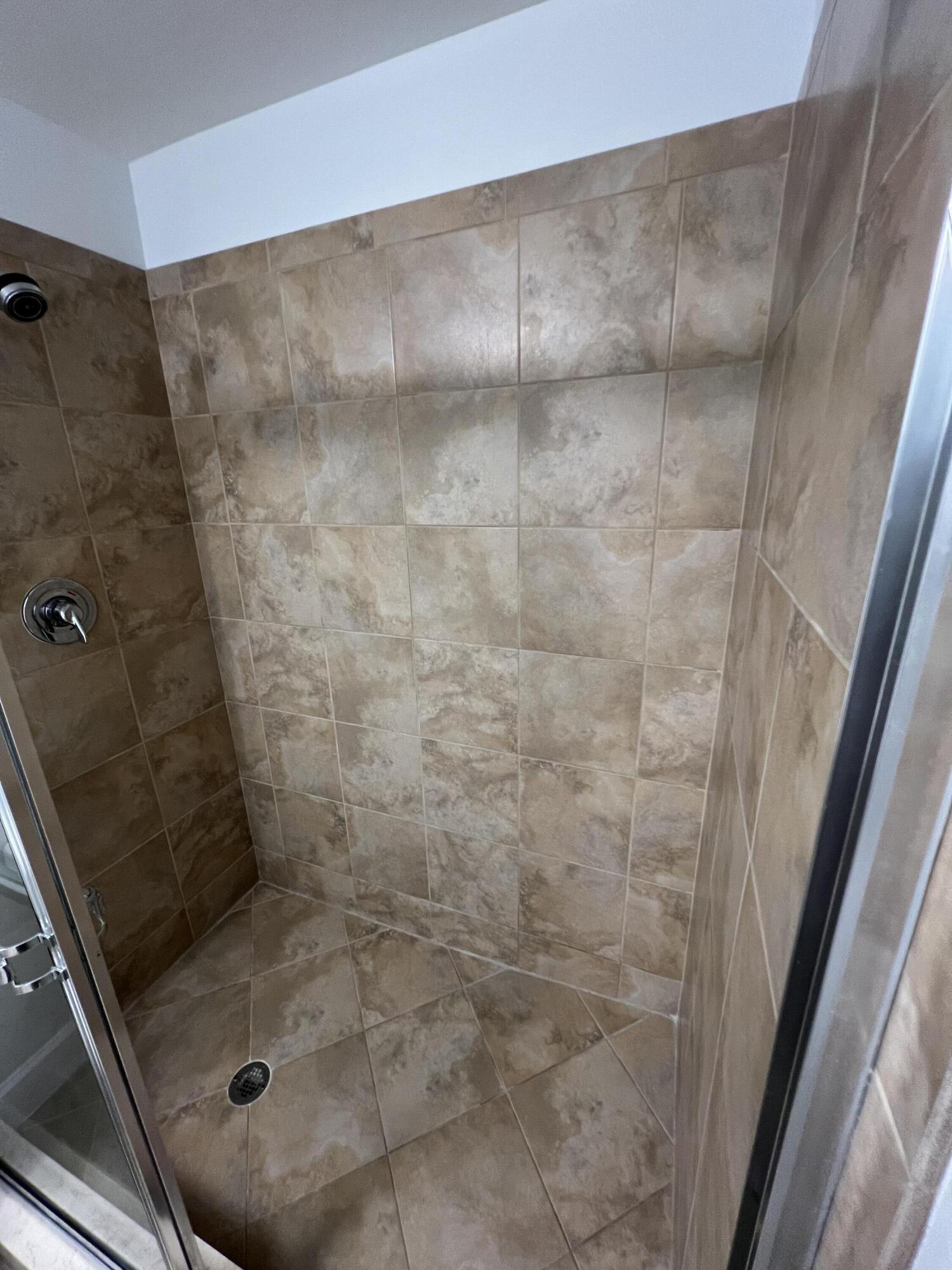 1660 Renaissance Commons Boulevard, Unit 2218 Boynton Beach, FL 33426 - Photo 12 of 23 a bathroom with a shower