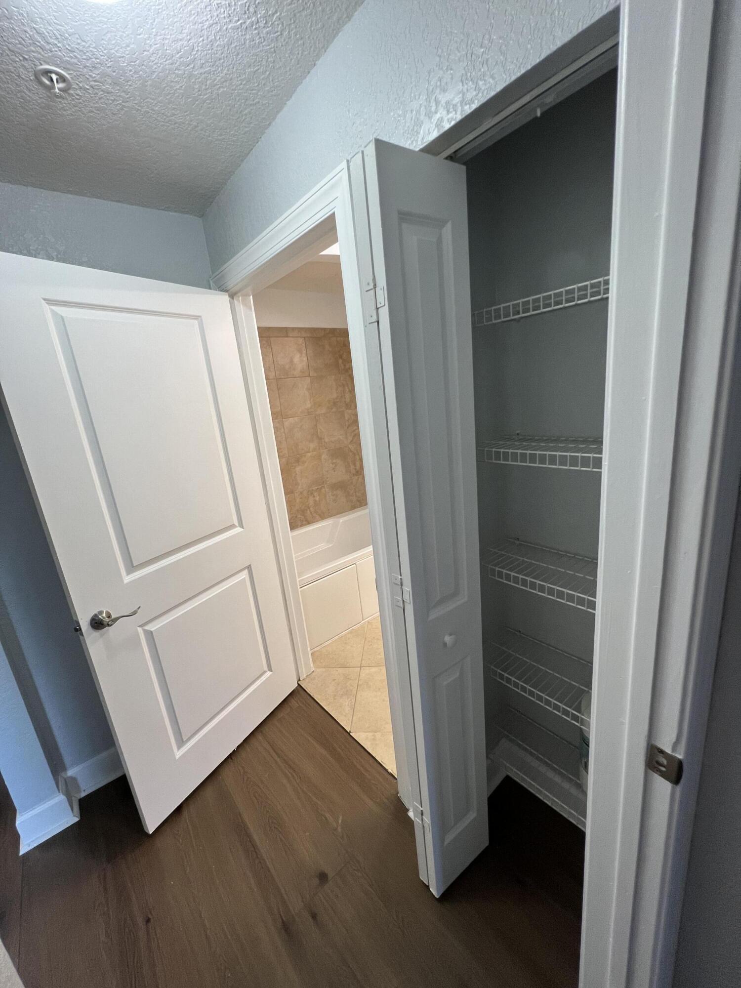 1660 Renaissance Commons Boulevard, Unit 2218 Boynton Beach, FL 33426 - Photo 17 of 23 a view of front door with wooden floor