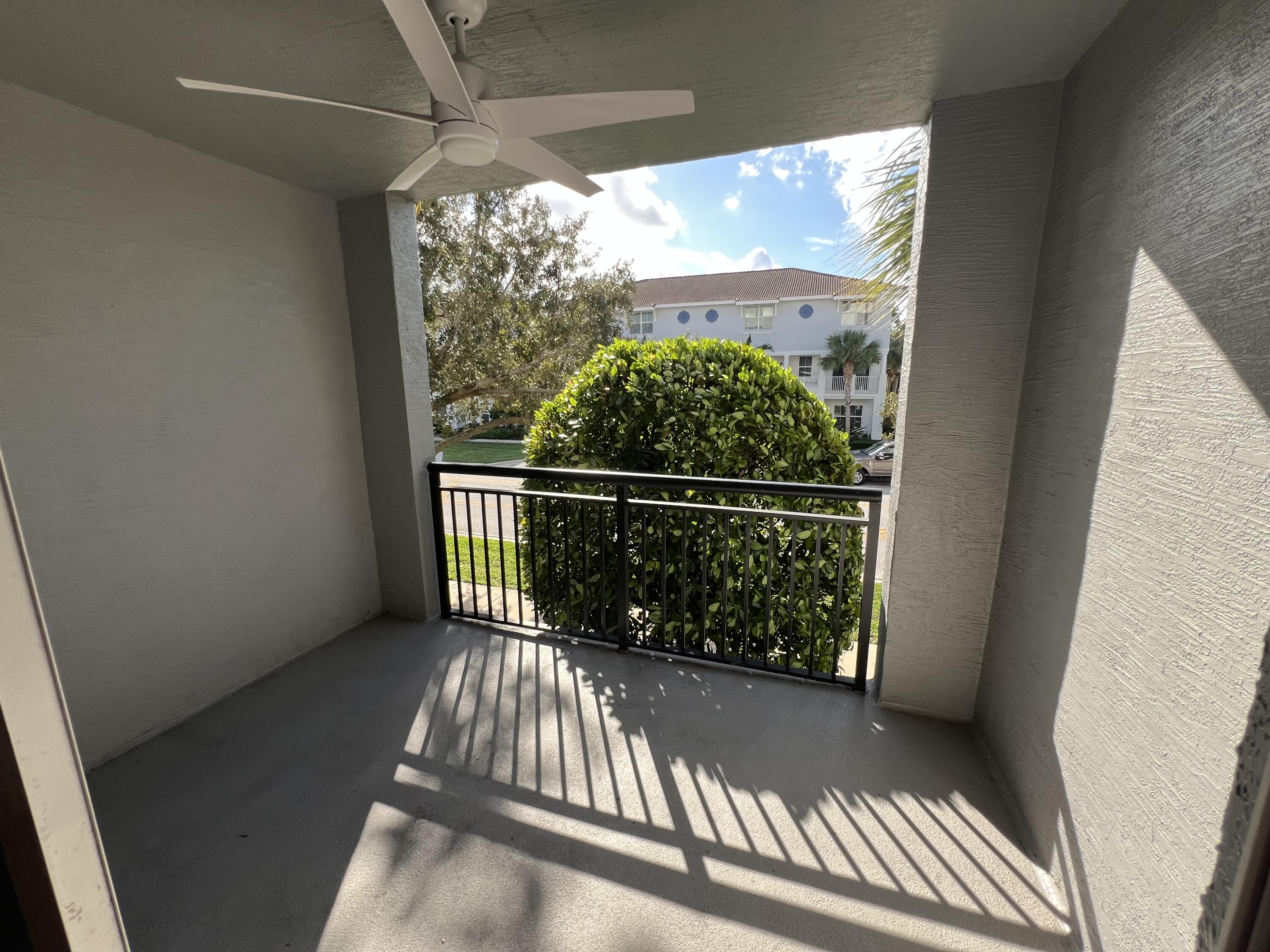 1660 Renaissance Commons Boulevard, Unit 2218 Boynton Beach, FL 33426 - Photo 22 of 23 a view of balcony with wooden floor
