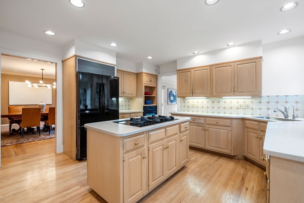 26 Bullard Road Weston, MA 02493 - Photo 11 of 31 a kitchen with stainless steel appliances granite countertop a stove a sink and a refrigerator