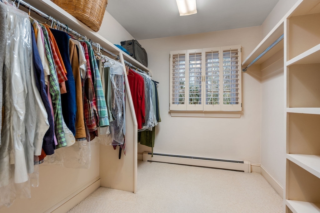 26 Bullard Road Weston, MA 02493 - Photo 19 of 31 a view of walk in closet with clothes and shoes