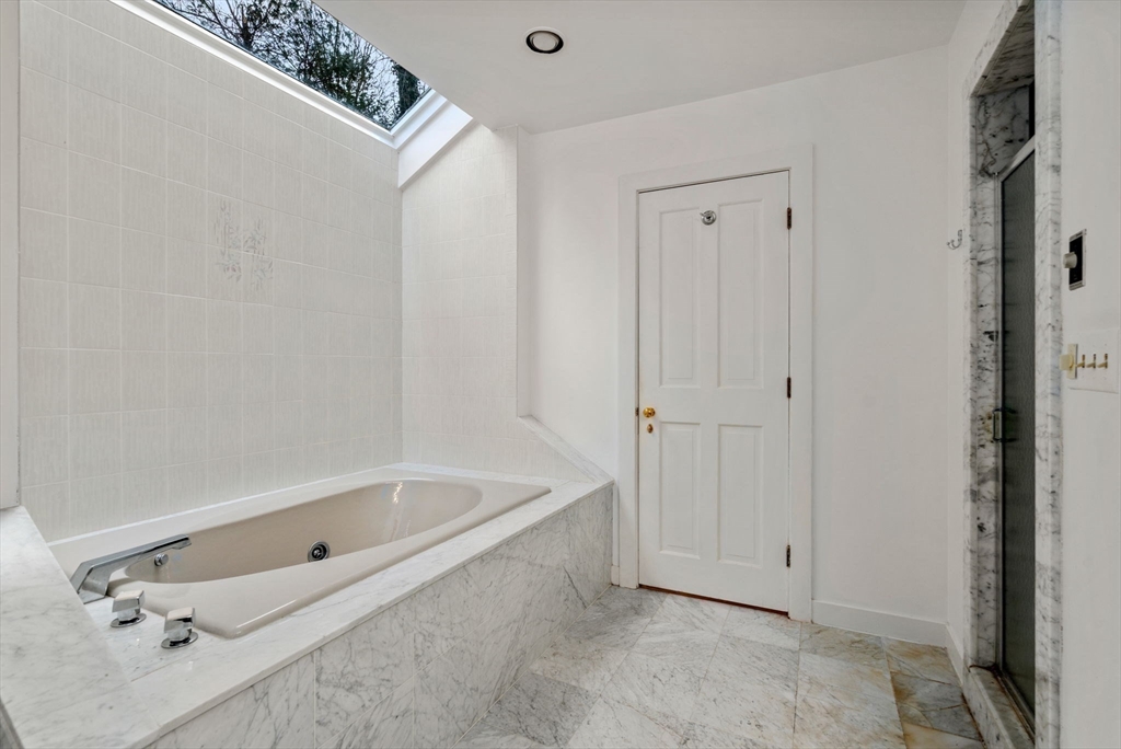 26 Bullard Road Weston, MA 02493 - Photo 22 of 31 a bathroom with a tub and shower