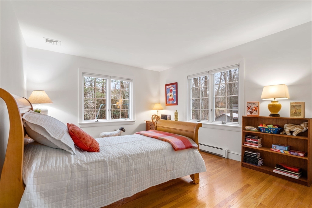 26 Bullard Road Weston, MA 02493 - Photo 27 of 31 a bedroom with a bed and window