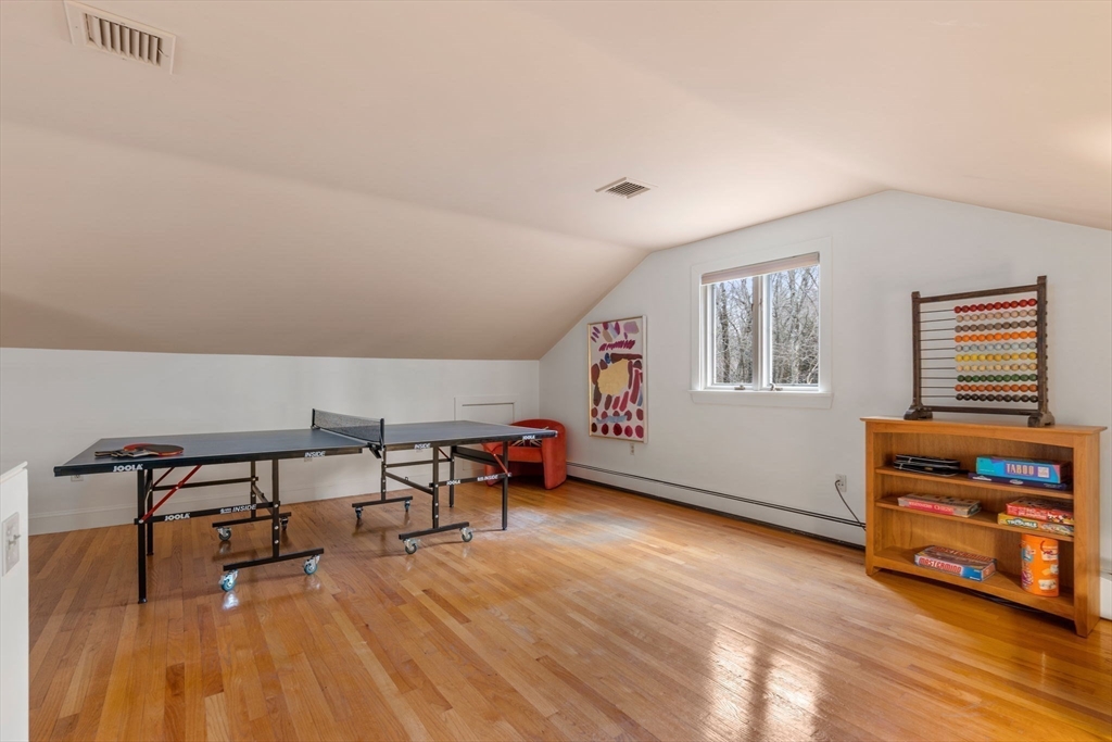 26 Bullard Road Weston, MA 02493 - Photo 29 of 31 a living room with furniture and a wooden floor