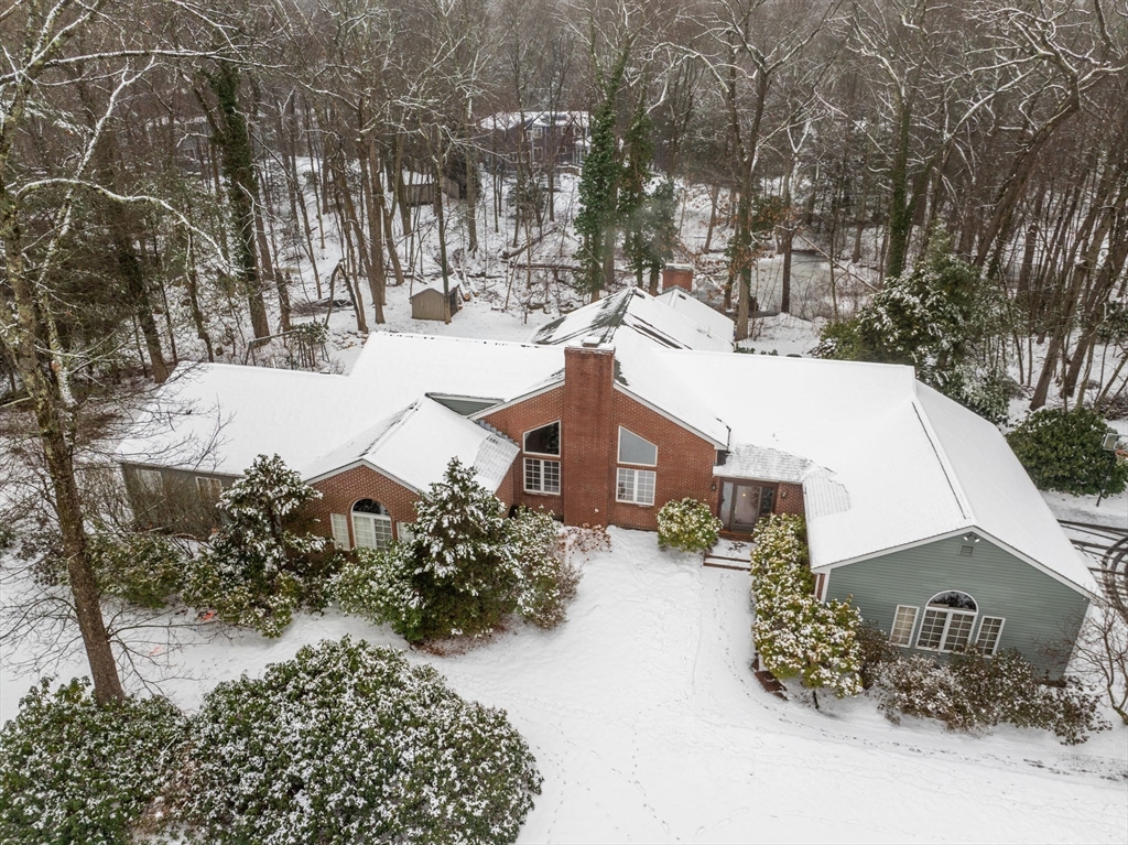 26 Bullard Road Weston, MA 02493 - Photo 3 of 31 a view of a house with a yard covered in snow