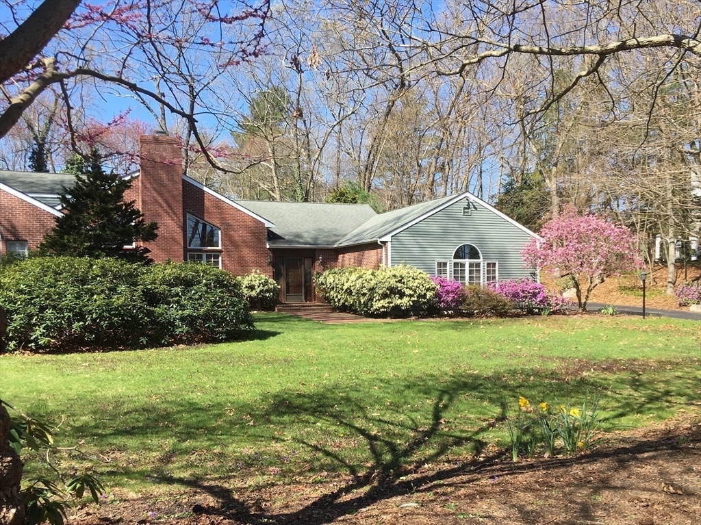 26 Bullard Road Weston, MA 02493 - Photo 31 of 31 a view of a white house with a yard and large trees