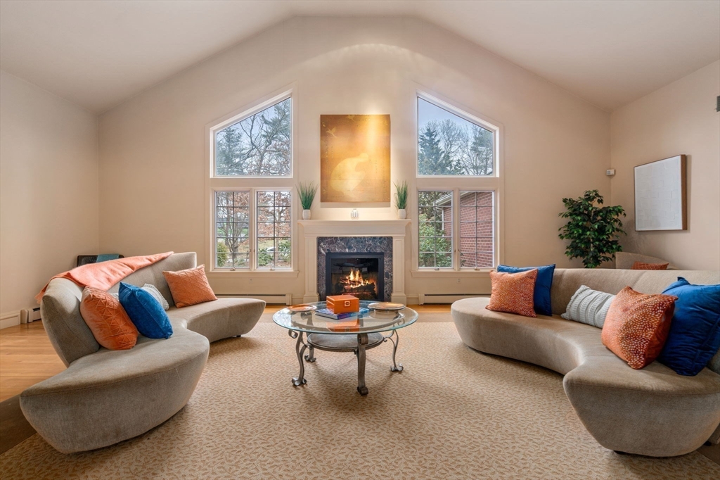 26 Bullard Road Weston, MA 02493 - Photo 5 of 31 a living room with furniture a rug and a fireplace