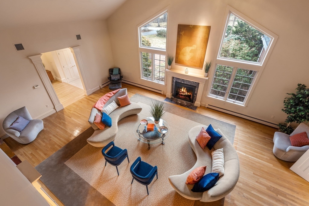 26 Bullard Road Weston, MA 02493 - Photo 6 of 31 a living room with furniture and a fireplace