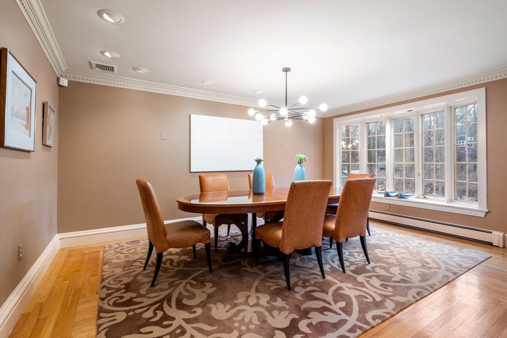 26 Bullard Road Weston, MA 02493 - Photo 8 of 31 a view of a dining room with furniture window and wooden floor