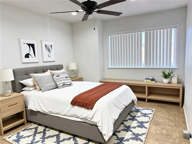 a bedroom with a bed and window