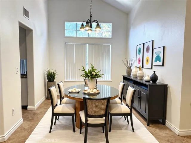 a bedroom with a bed a couch and potted plant with view