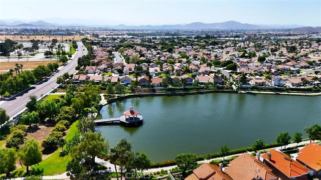 a room with pool table and windows