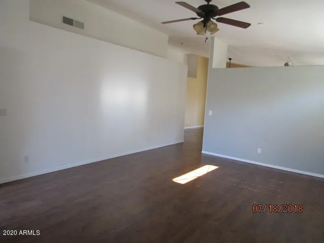 a kitchen with stainless steel appliances granite countertop a stove and a refrigerator