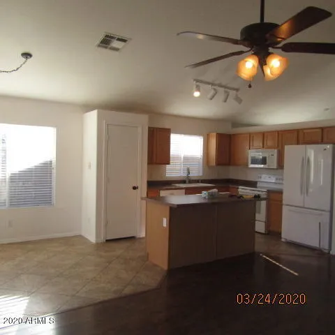 a kitchen with a counter space a sink and appliances