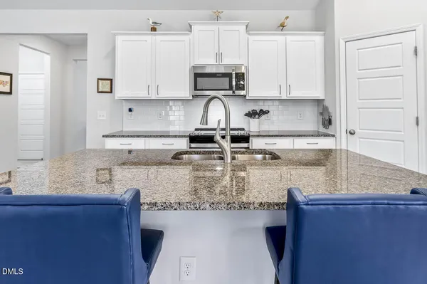 a bathroom with a toilet sink and shower