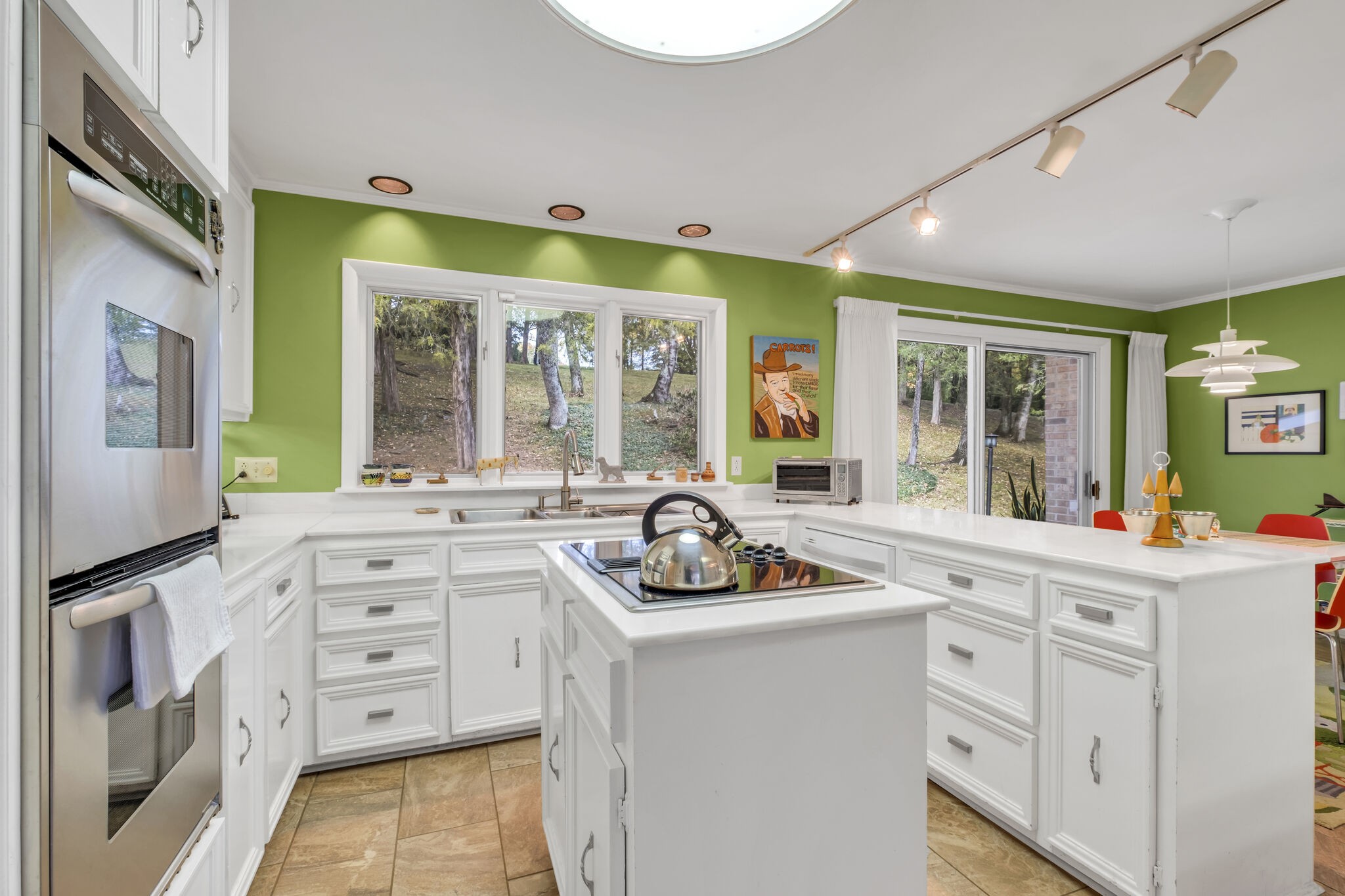 1524 Cherokee Road Gallatin, TN 37066 - Photo 27 of 65 a kitchen with white cabinets and window