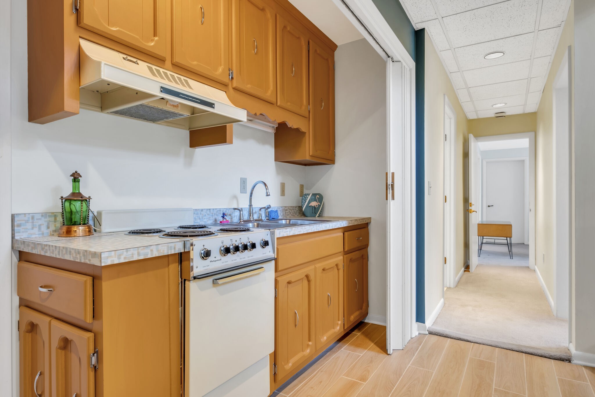 1524 Cherokee Road Gallatin, TN 37066 - Photo 43 of 65 a kitchen with stainless steel appliances granite countertop a sink a stove and a wooden floors