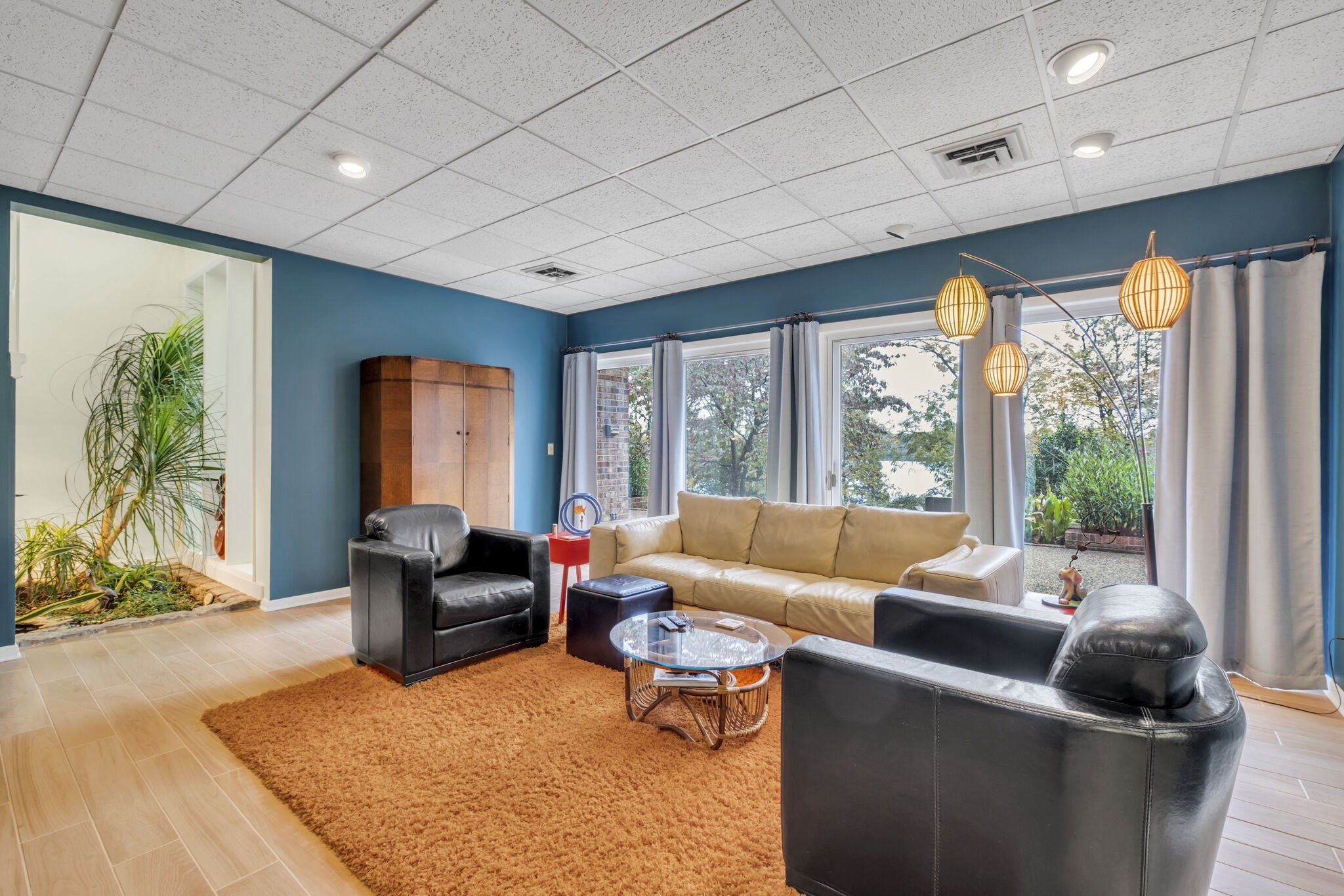 1524 Cherokee Road Gallatin, TN 37066 - Photo 45 of 65 a living room with furniture floor to ceiling window and a table