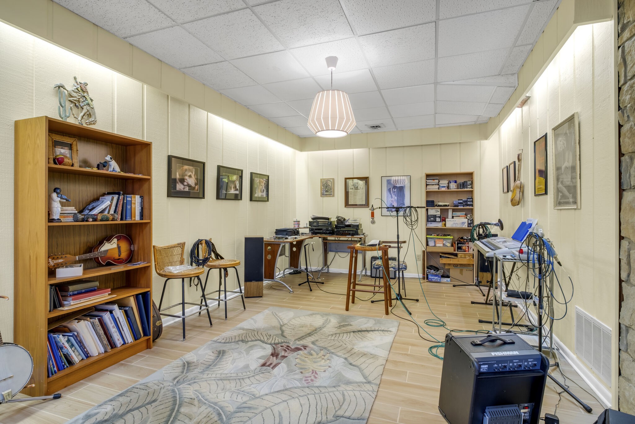 1524 Cherokee Road Gallatin, TN 37066 - Photo 46 of 65 a living room with lots of furniture and a book shelf