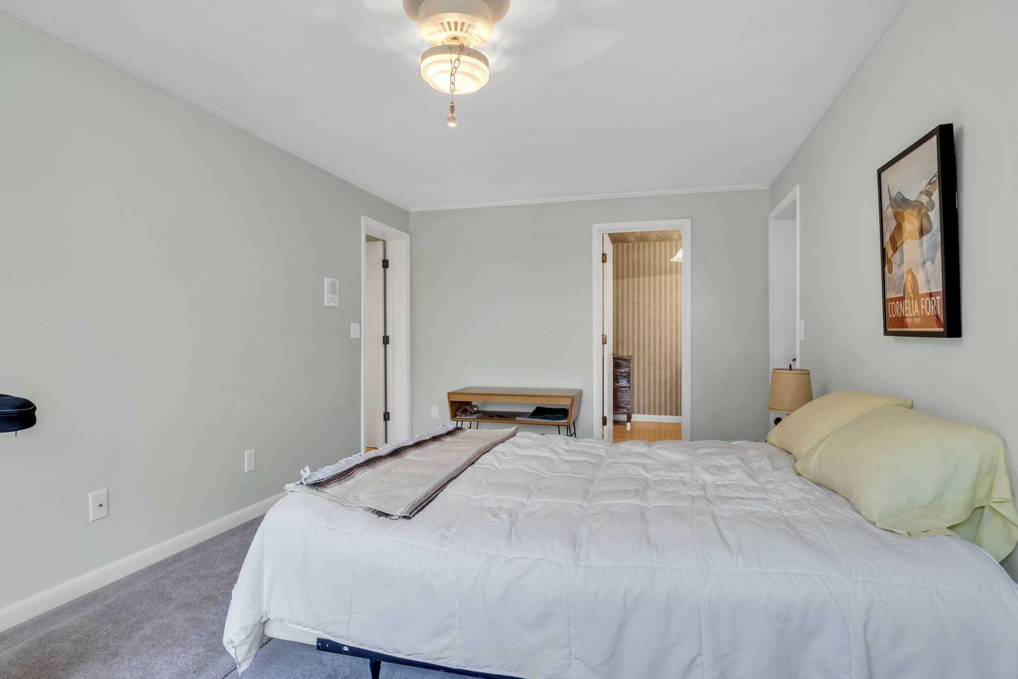 1524 Cherokee Road Gallatin, TN 37066 - Photo 49 of 65 a bedroom with a bed and a chandelier