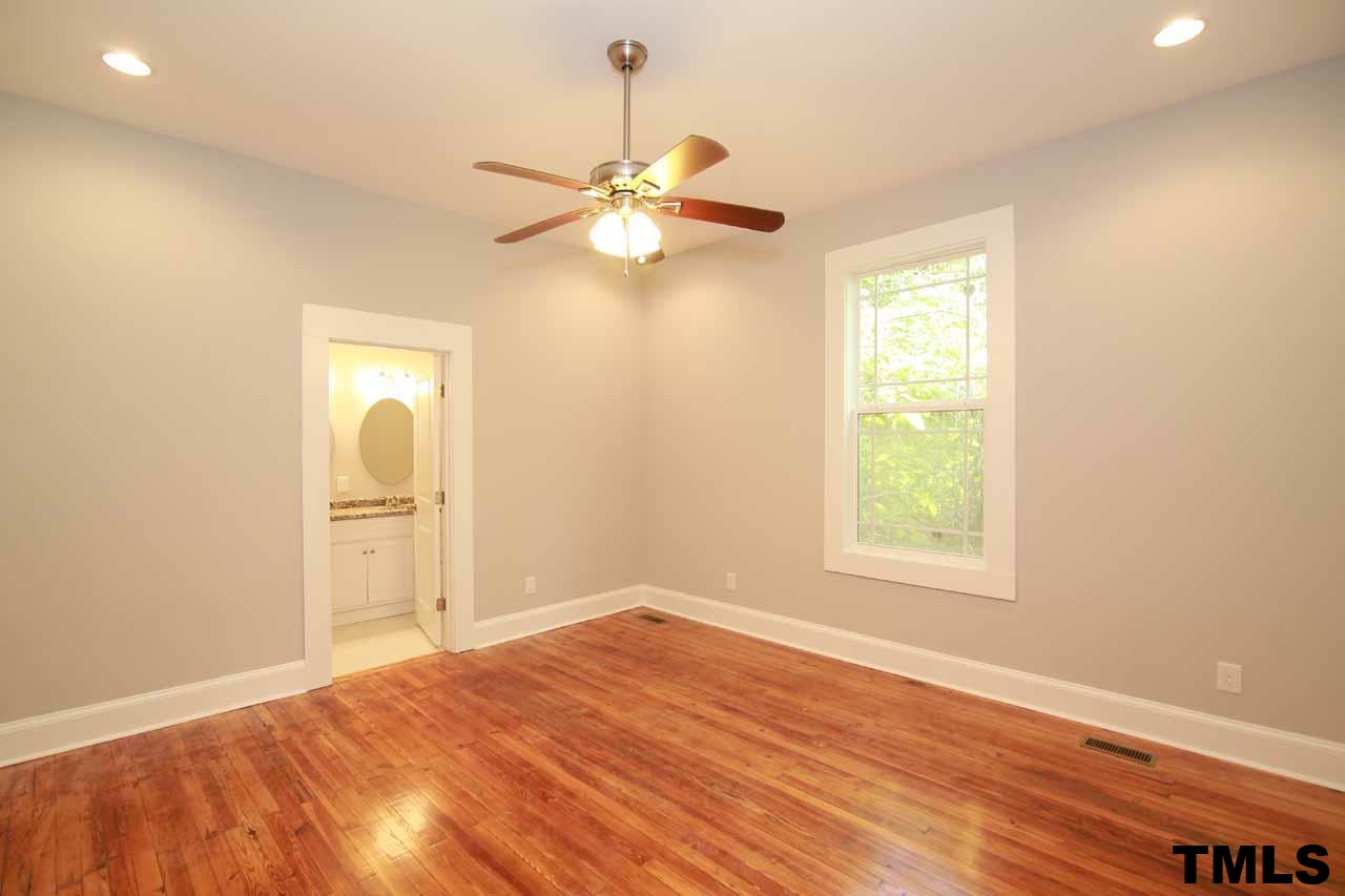 310 South State Street Raleigh, NC 27601 - Photo 13 of 25 a view of empty room with wooden floor and fan