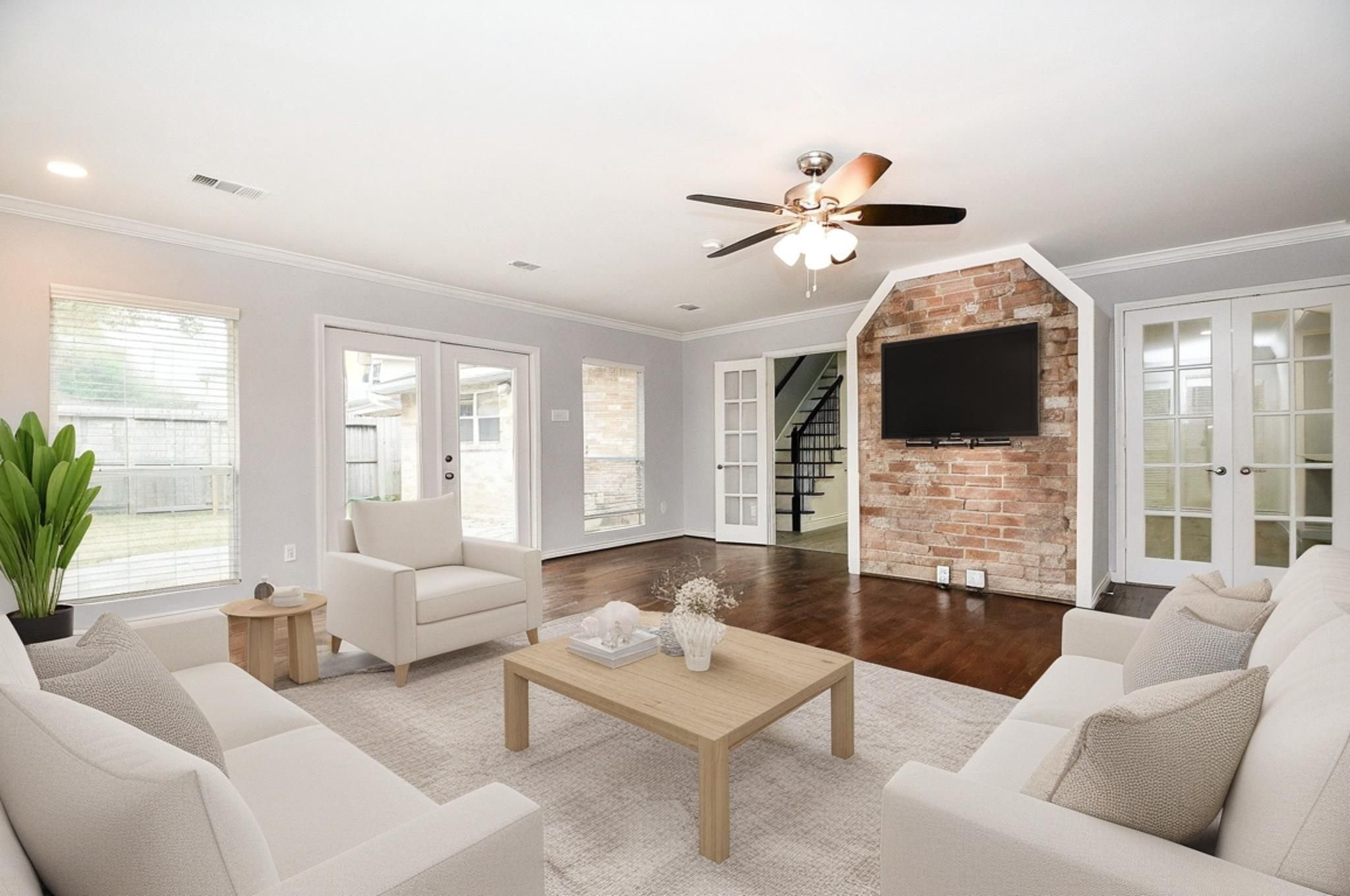 14011 Wickersham Lane Houston, TX 77077 - Photo 15 of 38 Walls of windows and stunning hardwood floors make this sunroom a true standout, all overlooking the private backyard. Virtual rendering to illustrate the size and layout flexibility of this space.