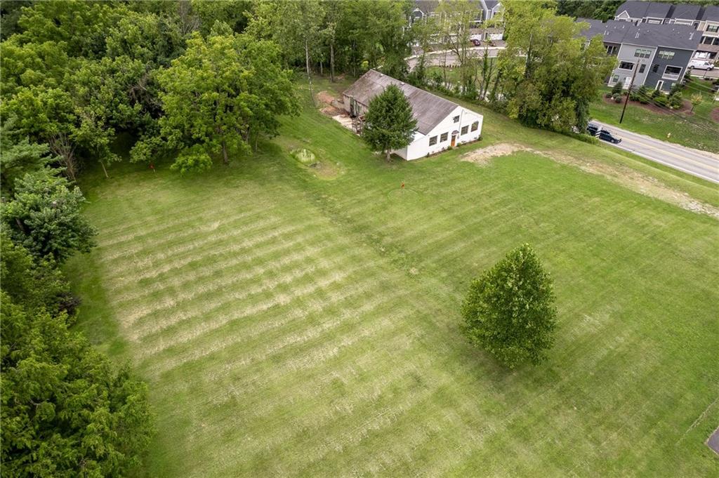 1243 Mayview Road Pittsburgh, PA 15241 - Photo 4 of 13 an aerial view of a house with a yard and lake view