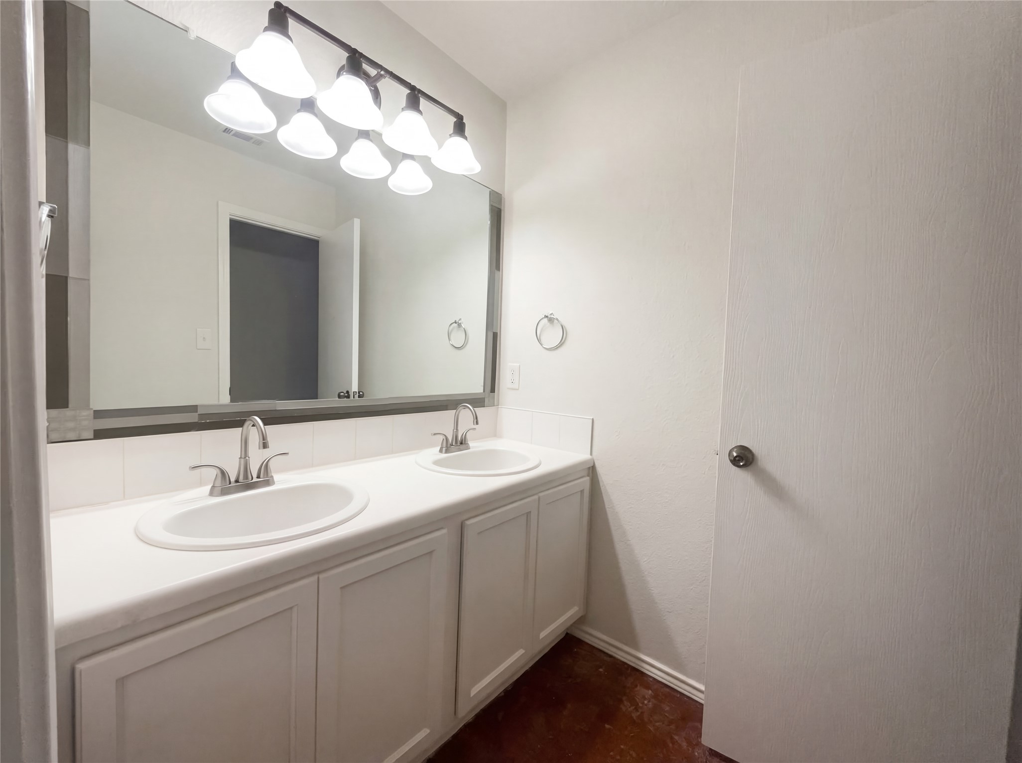 15305 Lucian Street Austin, TX 78725 - Photo 13 of 25 a bathroom with a sink and a mirror