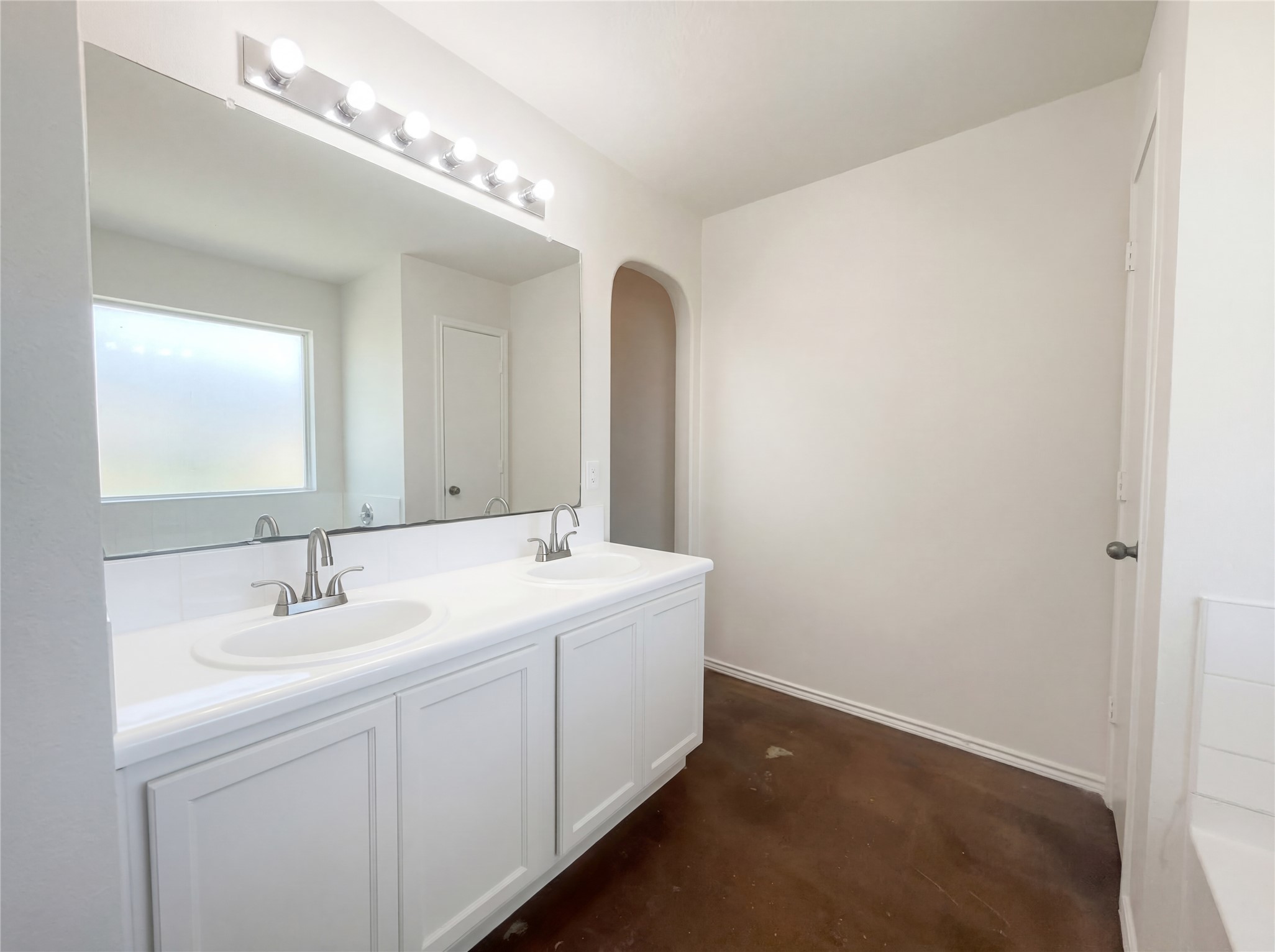 15305 Lucian Street Austin, TX 78725 - Photo 15 of 25 a bathroom with a double vanity sink and a mirror