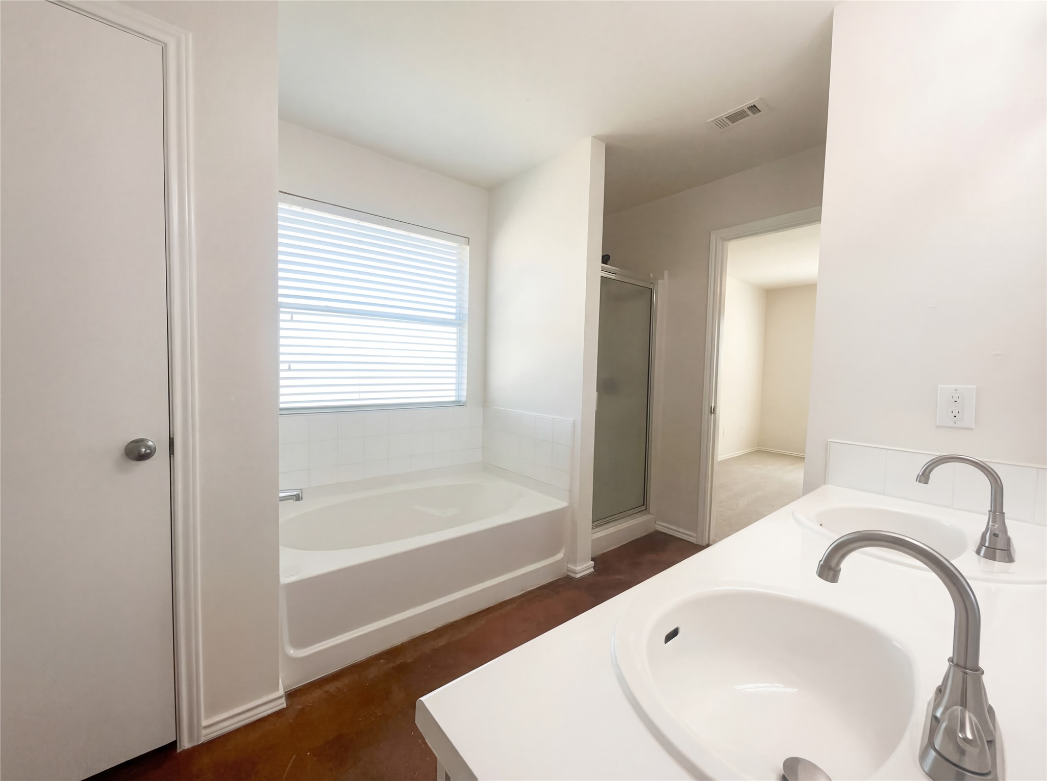 15305 Lucian Street Austin, TX 78725 - Photo 17 of 25 a bathroom with a sink and a bathtub