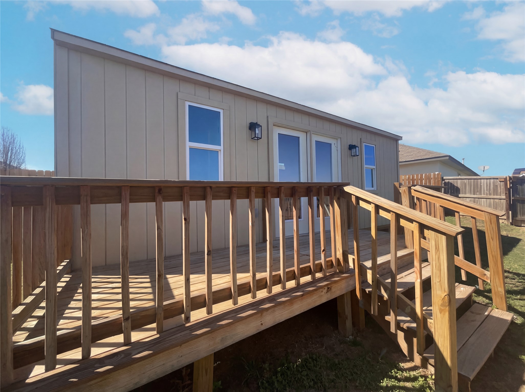 15305 Lucian Street Austin, TX 78725 - Photo 20 of 25 a view of a balcony with wooden stairs