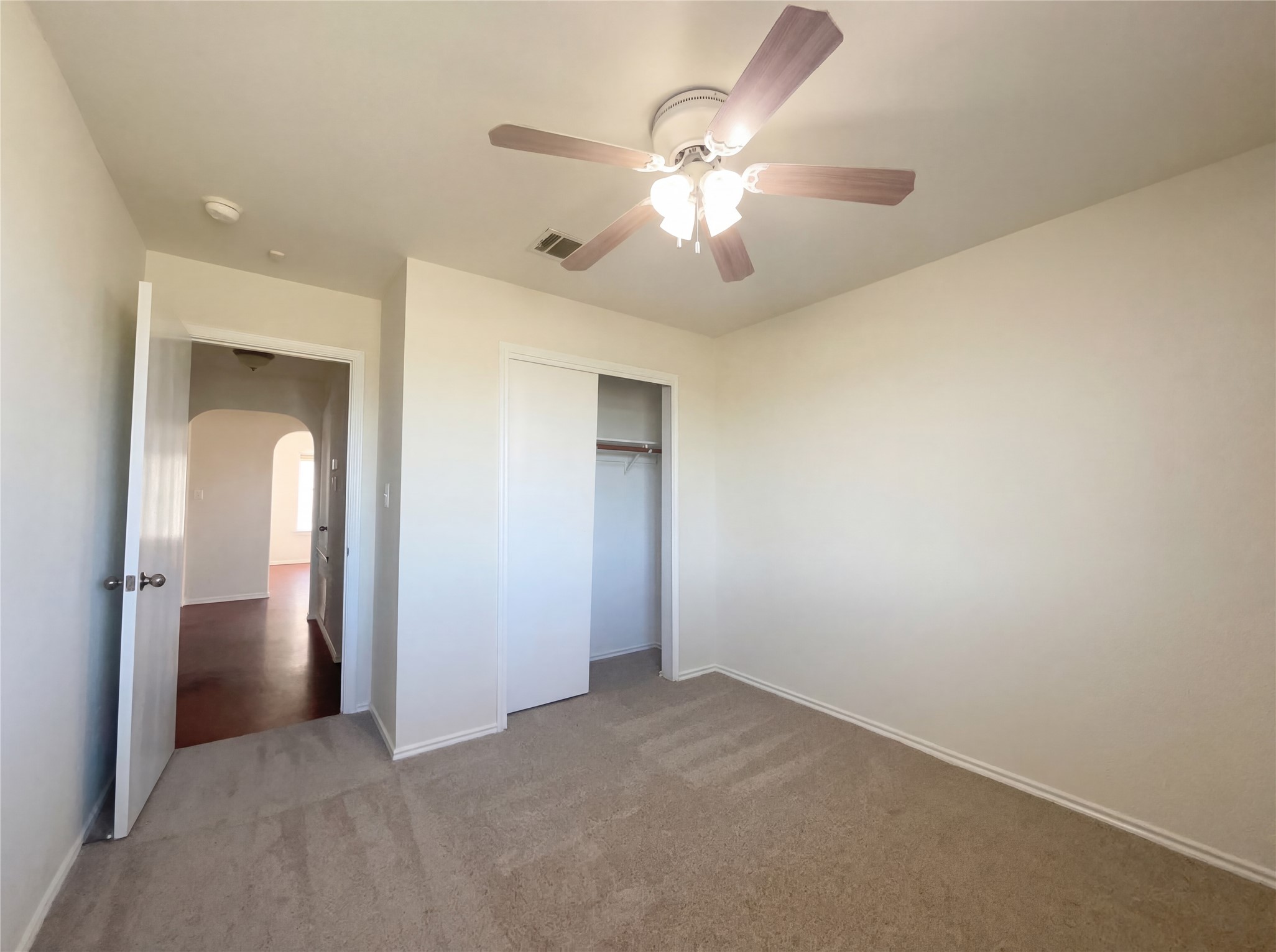 15305 Lucian Street Austin, TX 78725 - Photo 4 of 25 a view of an empty room with a chandelier fan