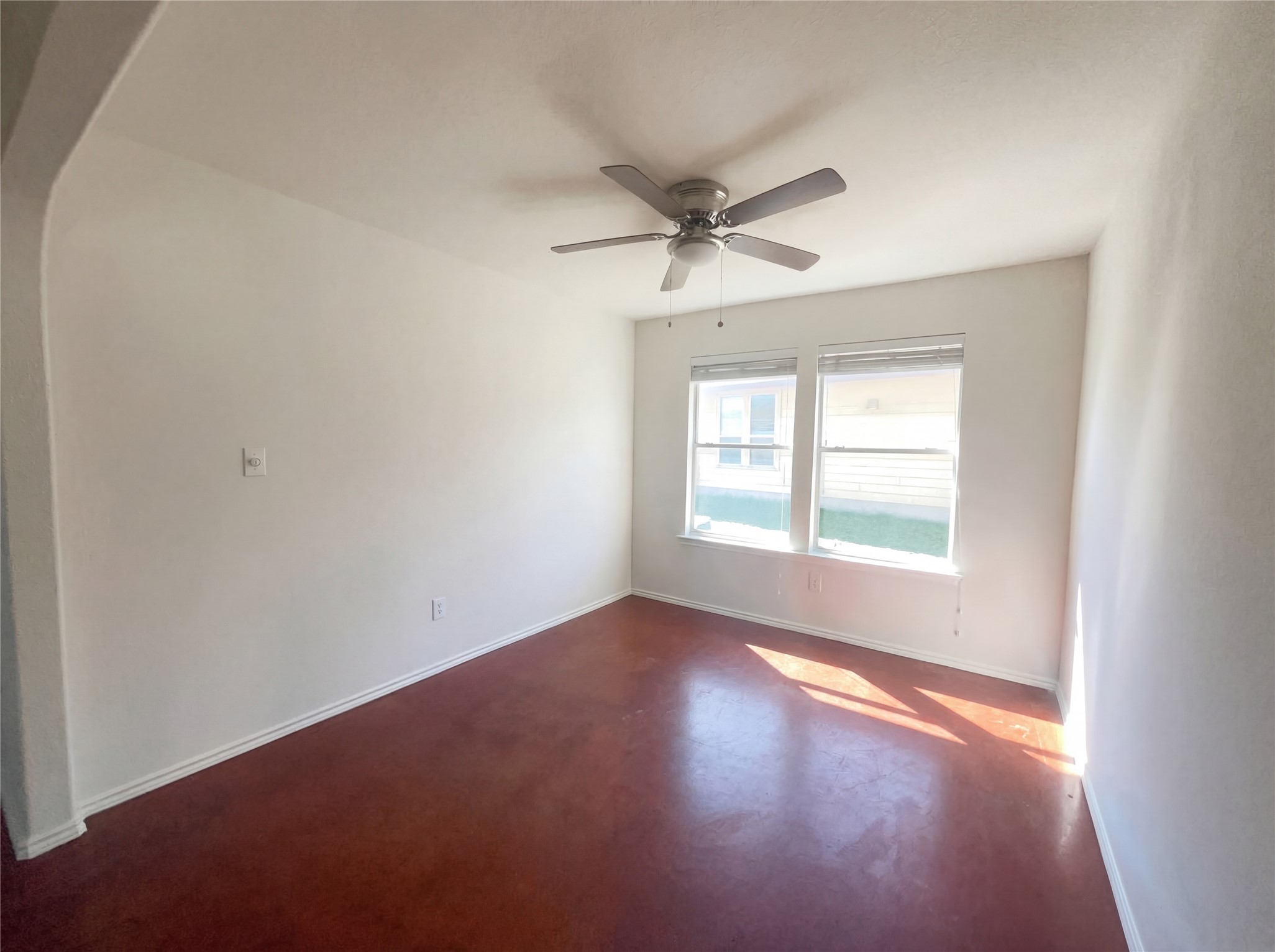 15305 Lucian Street Austin, TX 78725 - Photo 9 of 25 an empty room with a window and a fan