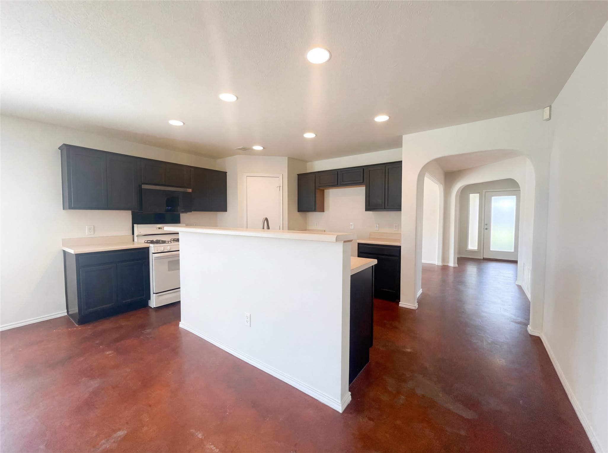15305 Lucian Street Austin, TX 78725 - Photo 10 of 25 a view of a kitchen with a sink cabinets and wooden floor