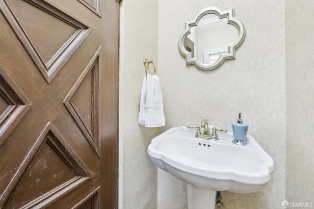 a bedroom with a large bed and a couch