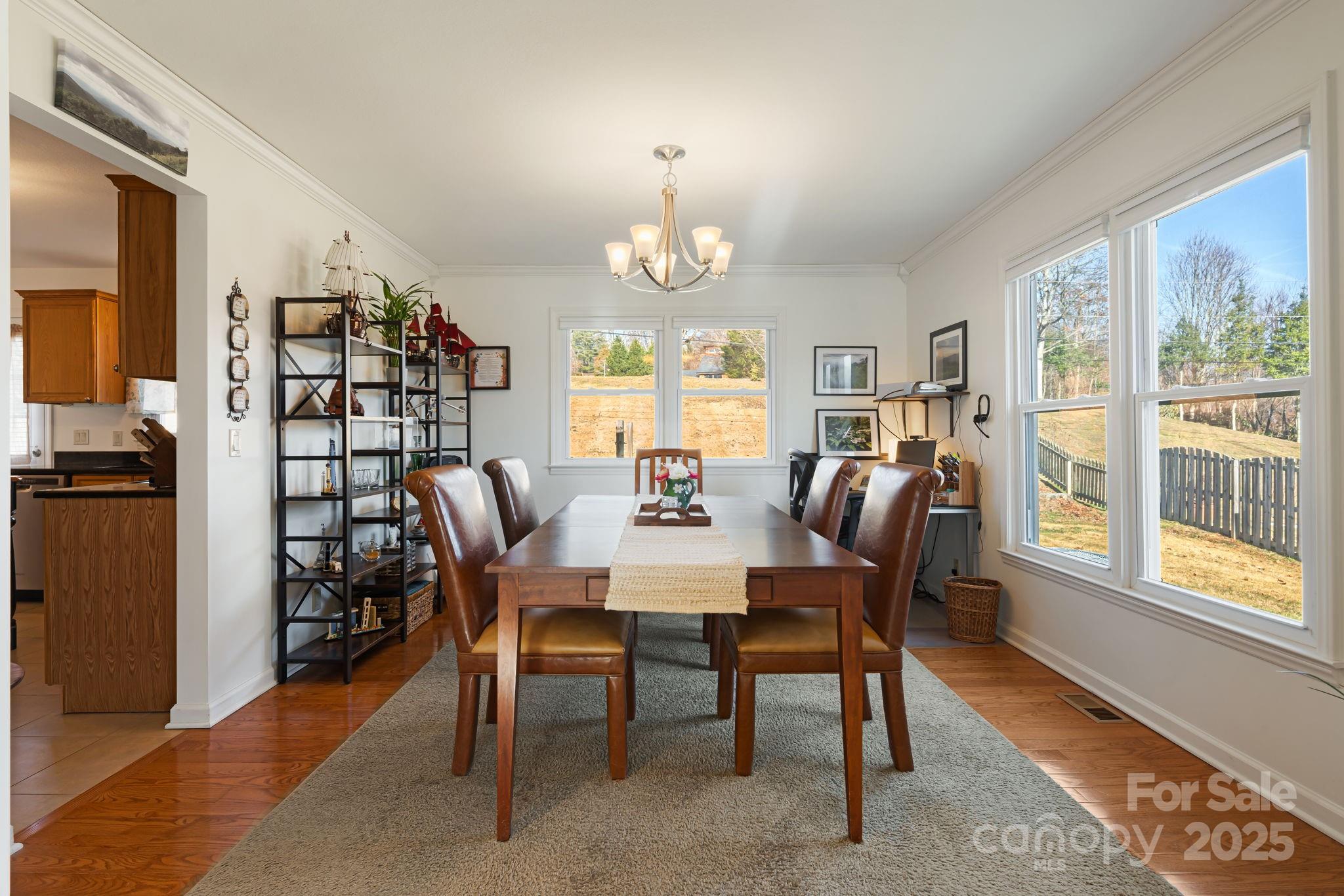 154 Harris Street Spruce Pine, NC 28777 - Photo 11 of 37 a view of a dining room with furniture window and wooden floor