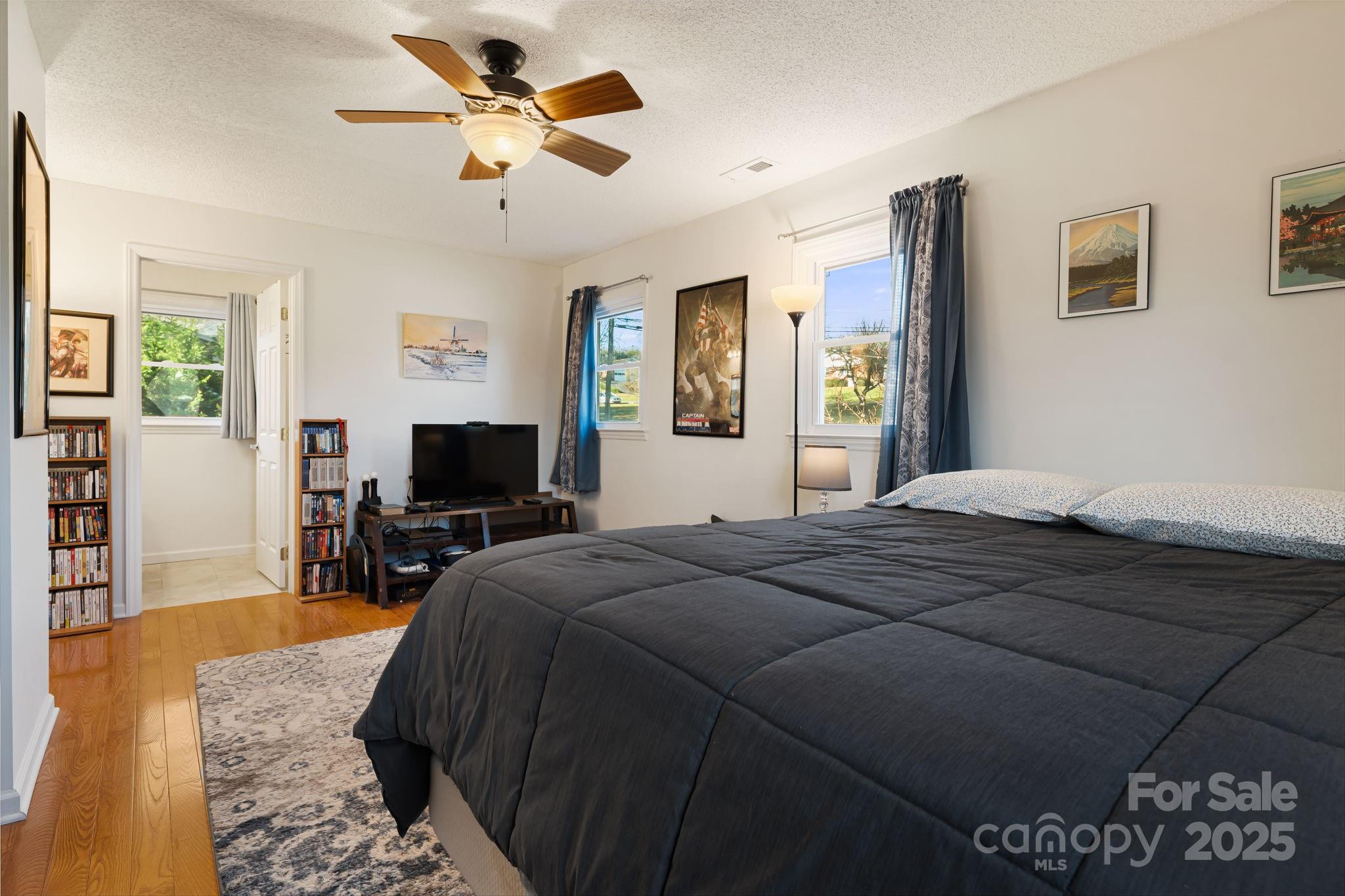 154 Harris Street Spruce Pine, NC 28777 - Photo 25 of 37 a bedroom with a bed and a flat screen tv