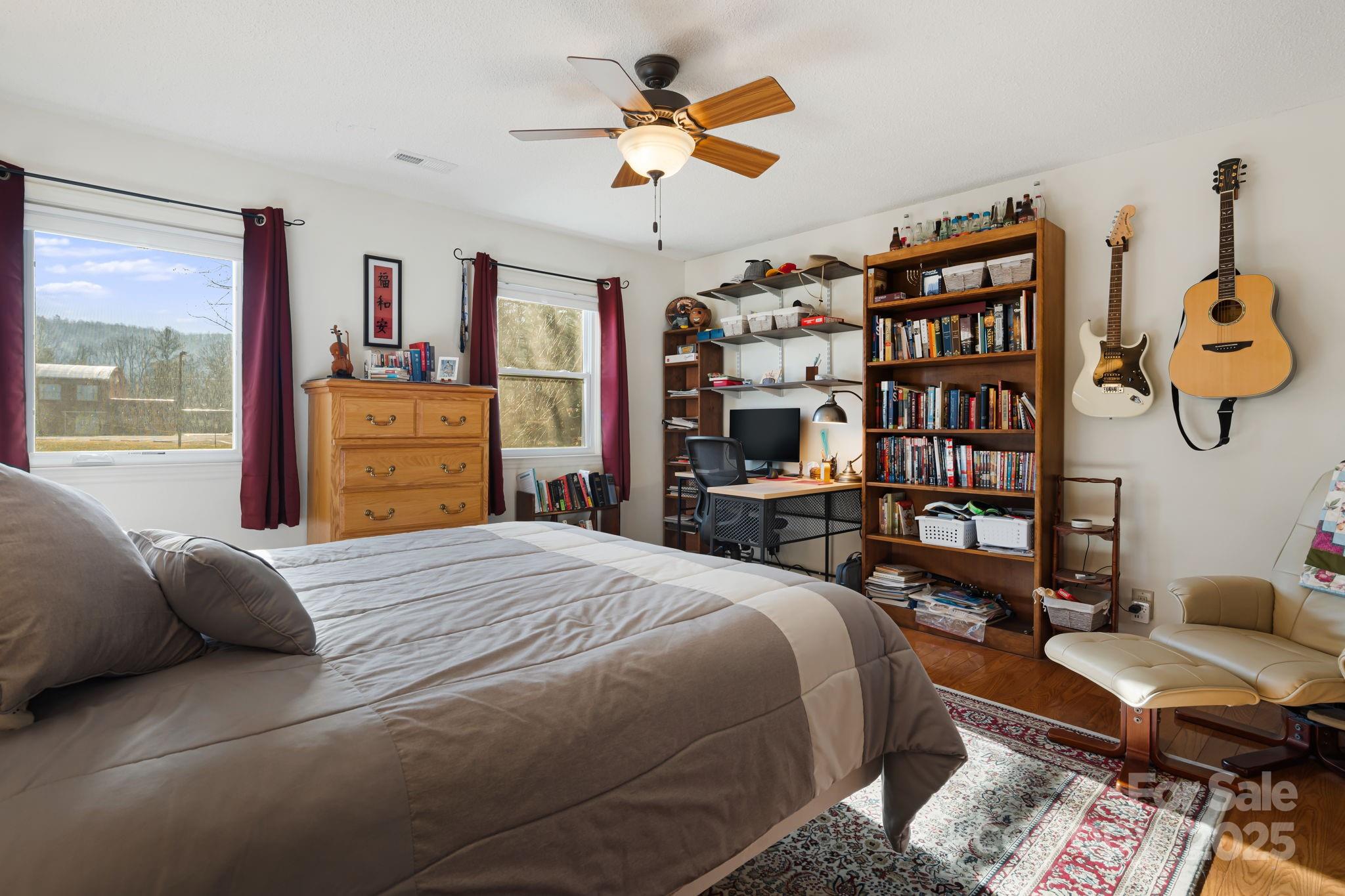 154 Harris Street Spruce Pine, NC 28777 - Photo 29 of 37 a bedroom with a bed furniture and a large window