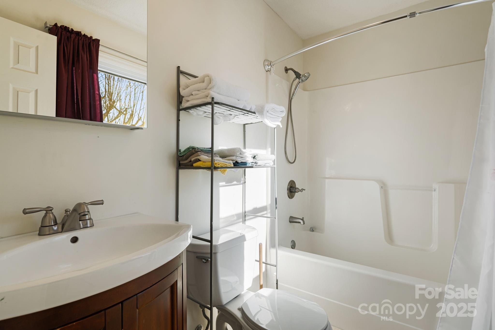 154 Harris Street Spruce Pine, NC 28777 - Photo 31 of 37 a bathroom with a sink toilet and shower