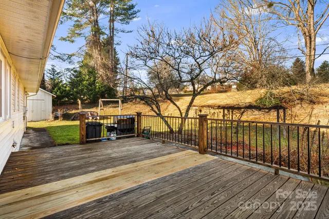 a view of a house with trees in the background